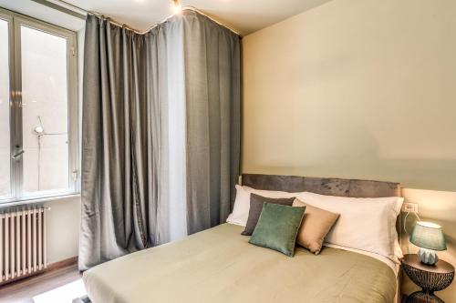 a bedroom with a bed with a large window at DOWNTOWN SRL - Cinque Terre Dream in La Spezia