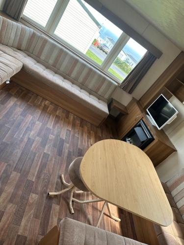 a living room with a table and a couch at Ocean View B3 in Hartlepool