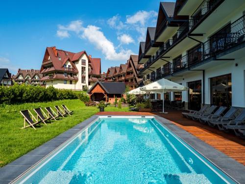 สระว่ายน้ำที่อยู่ใกล้ ๆ หรือใน Hotel Paryski Art & Business Zakopane - Basen Jacuzzi Sauna Małpi Gaj