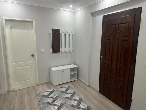 an empty room with a door and a rug at KUŞADASI’NDA SAHİLE 200 METRE in Kusadası