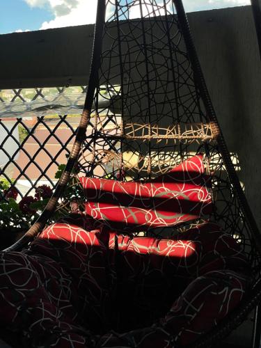 a basket filled with red and black pillows at Mini Hotel 7 Street in Sukhum
