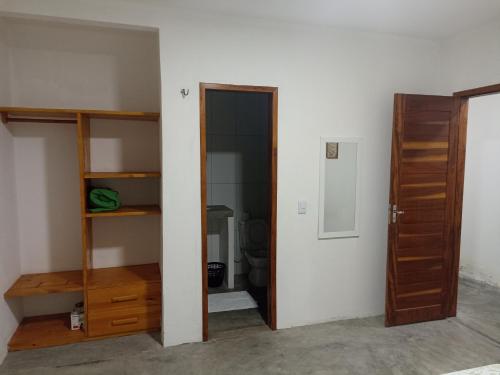 an empty room with a closet and a door at Casa Teodoro!!! in Trairi