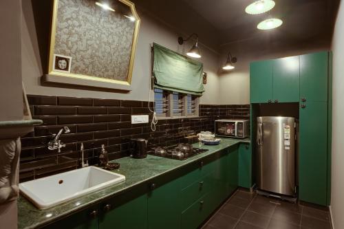 A cozinha ou cozinha compacta de Hoodo Zoe - Hebbal Bangalore Apartments
