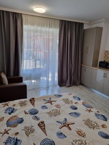 a room with a bed with stars on it at Garsoniera Adriana in Mangalia