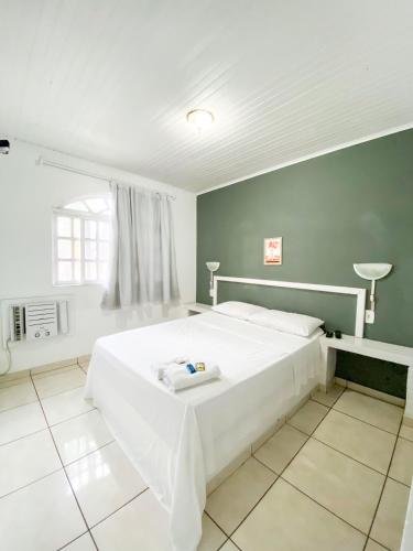 Ένα ή περισσότερα κρεβάτια σε δωμάτιο στο Sunshine Alto Buzios