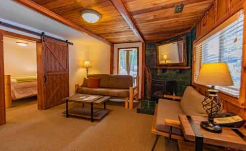 a living room with a couch and a table at Cooper Spur Mountain Resort in Mount Hood