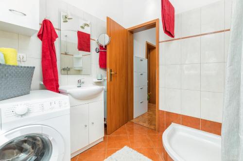 a bathroom with a washing machine and a sink at Denis in Vodnjan