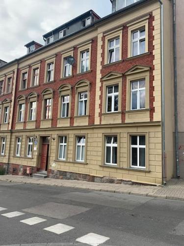 a large brick building on the side of a street at apartament- Stare Miasto Olsztyn in Olsztyn