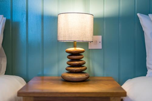 a zebra rock lamp on a table in a bedroom at The Queens in Carlisle