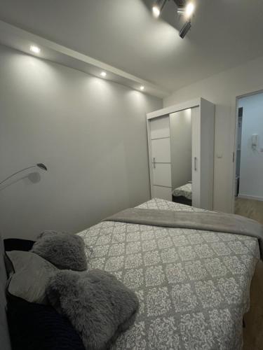 Postel nebo postele na pokoji v ubytování Apartament blisko plaży