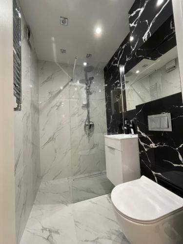 Koupelna v ubytování Apartament blisko plaży