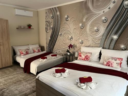 Ένα ή περισσότερα κρεβάτια σε δωμάτιο στο Oreo Apartman