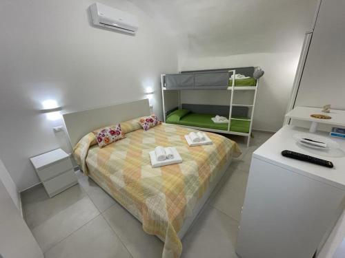 a small bedroom with a bed and a desk at Sea Paradise in Gallipoli