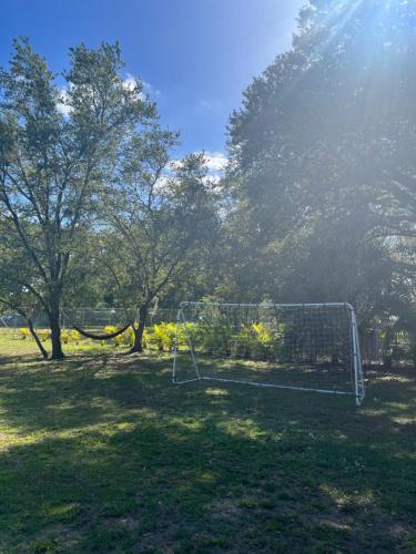a soccer net in a field with trees at The Perfect Get Away !!!! in Clewiston