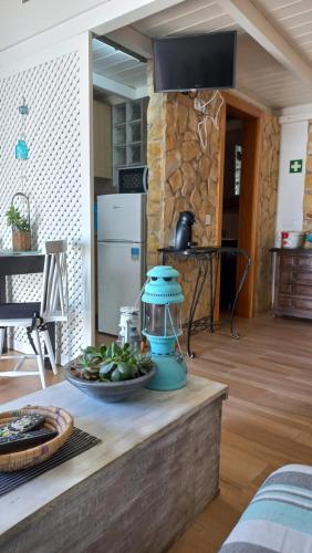 a counter with a bowl of fruit on a table at Casa Marreiros Holiday Home in Vila do Bispo