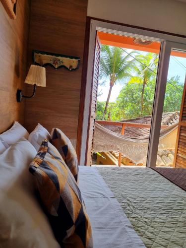 Кровать или кровати в номере Pousada Bahia Bella