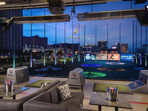 a room with a view of a city at night at Amalz Suites Collection at MGM Signature ! in Las Vegas