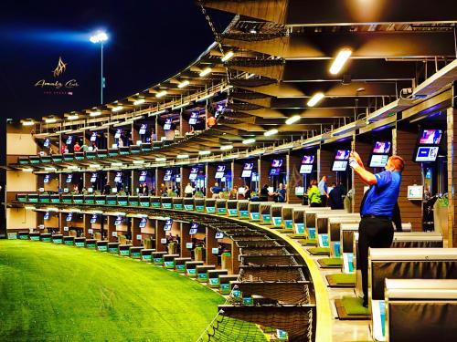 a man is standing in a baseball stadium at Amalz Suites Collection at MGM Signature ! in Las Vegas