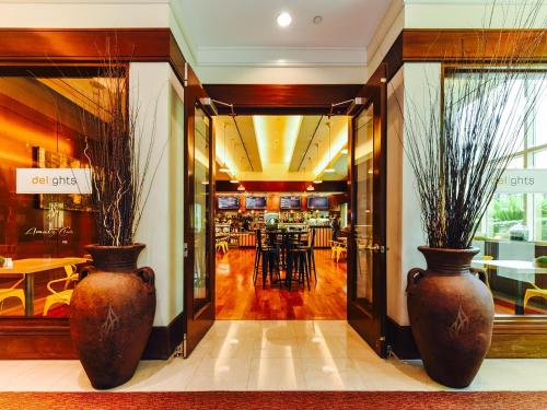 two large vases sitting in the entrance to a restaurant at Amalz Suites Collection at MGM Signature ! in Las Vegas
