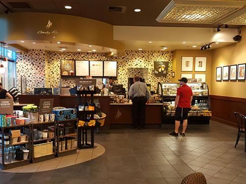a store with people standing inside of a store at Amalz Suites Collection at MGM Signature ! in Las Vegas