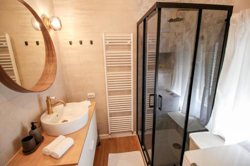 a bathroom with a sink and a shower at Apartment Castelmuschio in Omišalj