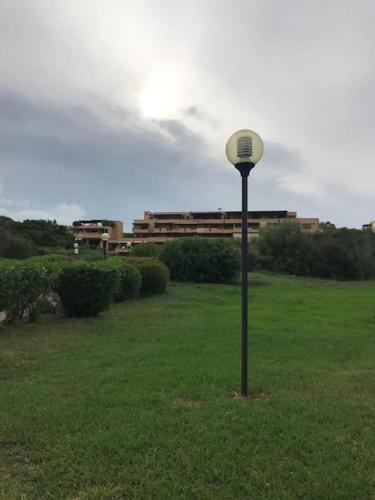 a light pole in the middle of a field at Monolocale a due minuti dal mare IUN R4225 in Marina di Portisco