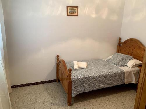 a bedroom with a bed with two pillows on it at Barragán 1 in Puerto Real