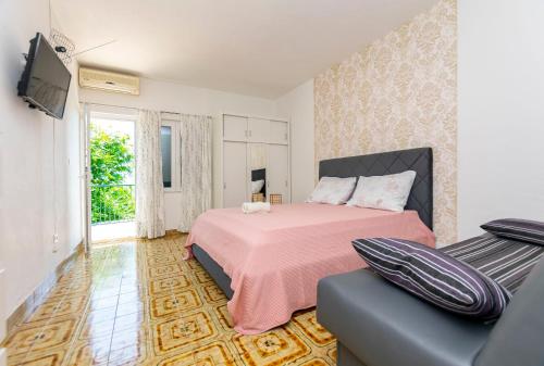 Postel nebo postele na pokoji v ubytování Apartments Nikola