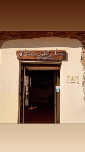 an entrance to a building with a sign on it at Al Podere del Nonno Romolo in Sansepolcro