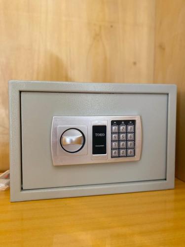 a television with a remote control sitting on a table at B&B Casa Benvenuto in Diamante