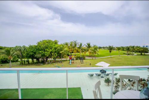 a view of a park from the balcony of a resort at Hard Rock at Cana Rock 1 by Unwind Properties in Punta Cana