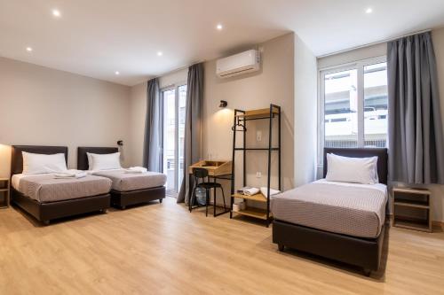 Postel nebo postele na pokoji v ubytování New Amaryllis Hotel