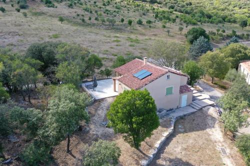 an aerial view of a small white house with a red roof at Mas des Anges in Sauve