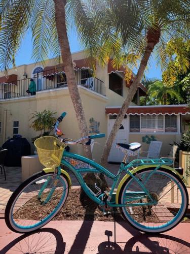 a blue bike parked in front of a house at Banyan House Vacation Rentals in Venice