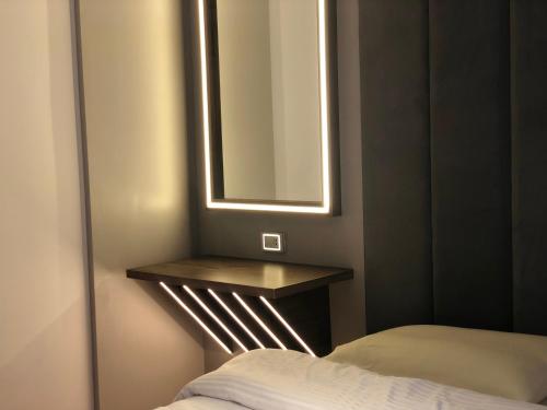 a bedroom with a table and a mirror and a bed at Sheraton Ocean 601-B - Without Pool access in Cairo