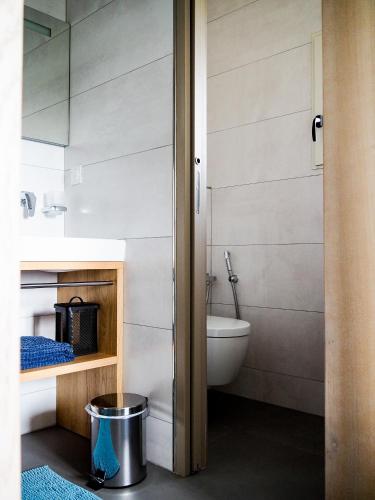 a bathroom with a toilet and a sink at Mas Grenadine, magnifique villa du Piémont Cévenol in Sauve