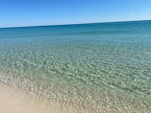 a view of the ocean from the beach at Your Beach Therapy Awaits at Sans Souci in Pensacola Beach