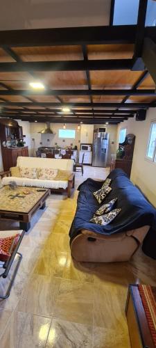 a living room with a large bed in a room at Finca san benito in Puerto Madryn