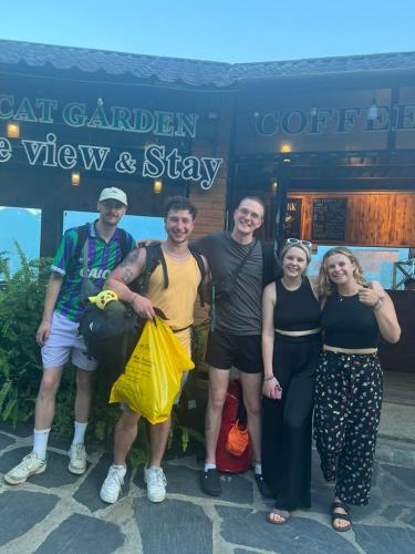 a group of people standing in front of a store at Catcat Garden House in Sa Pa