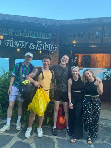 a group of people standing in front of a building at Catcat Garden House in Sa Pa
