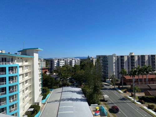 an aerial view of a city street with buildings at Redvue Holiday Apartments in Redcliffe