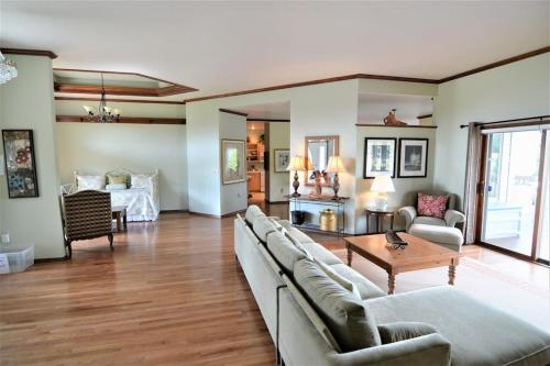 a living room with a couch and a table at Carraig Nua House in Fish Creek