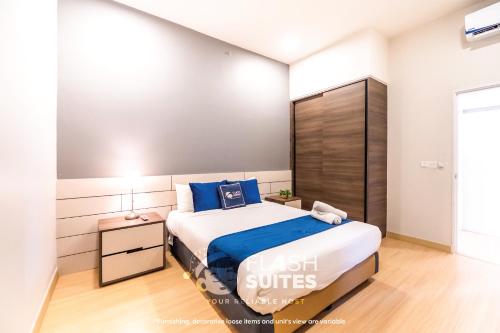 a bedroom with a large bed in a room at Windmill Upon Hills Premium Suites Genting Highland in Genting Highlands