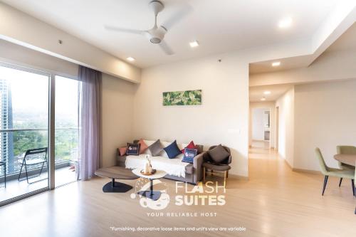 a living room with a couch and a table at Windmill Upon Hills Premium Suites Genting Highland in Genting Highlands