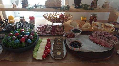 a table with many different types of food on it at Fexada Home in Vama