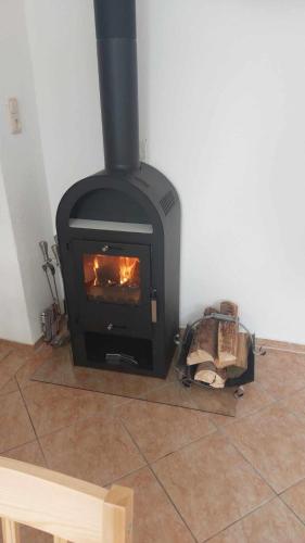 a fireplace sitting on the floor in a room at Ferienwohnung am Hofladen Hellendorf - Sächsische Schweiz in Bad Gottleuba