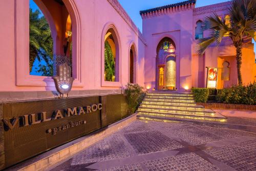 a building with a sign that reads villa marquez at Villa Maroc Resort in Pran Buri