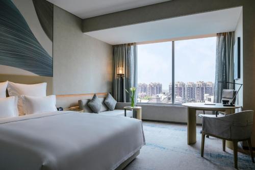 Pullman Shanghai Qingpu Excellenceにあるベッド