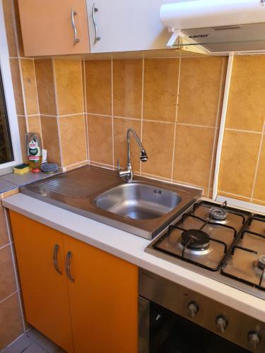 a kitchen with a sink and a stove at Apartament vacanta in Mangalia