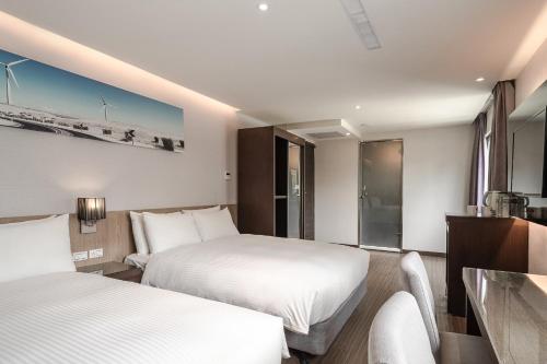 Postel nebo postele na pokoji v ubytování Hotel Yoshi